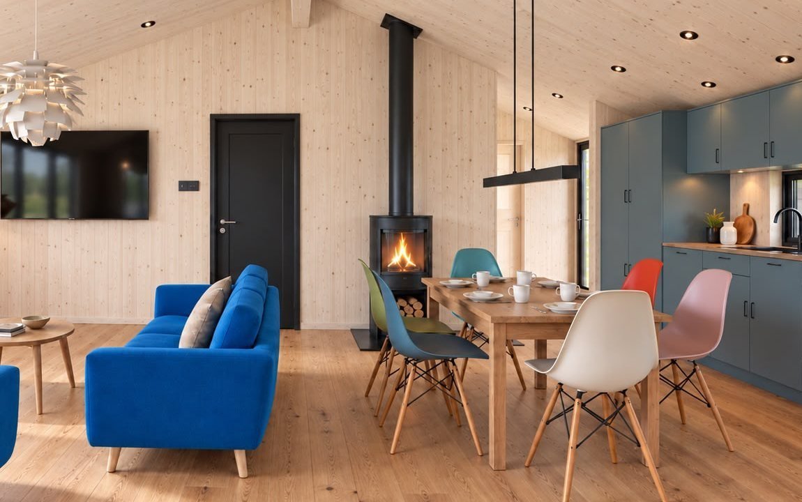 Visualisatie van de woonkamer van Dansk Cottage met houtkachel